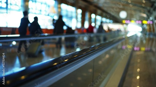 Wallpaper Mural 4k Ultra hd shot of travalator in airport madrid. People with luggage bags and backpacks move by it. Big depth of field blurred background view. Torontodigital.ca