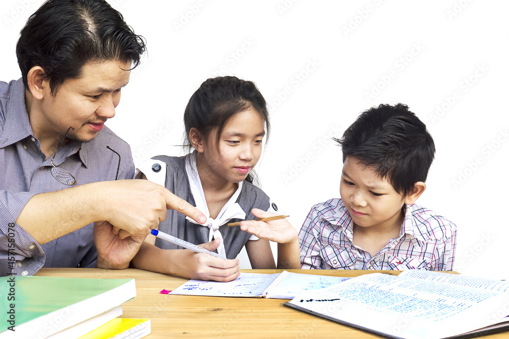 Daddy teaching his kids during doing homework Daddy teaching his kids during doing homework