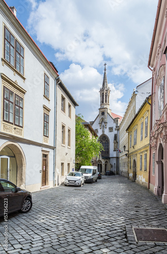 Small church at the end of the street in the old town of the city of Sopron, Hungary 