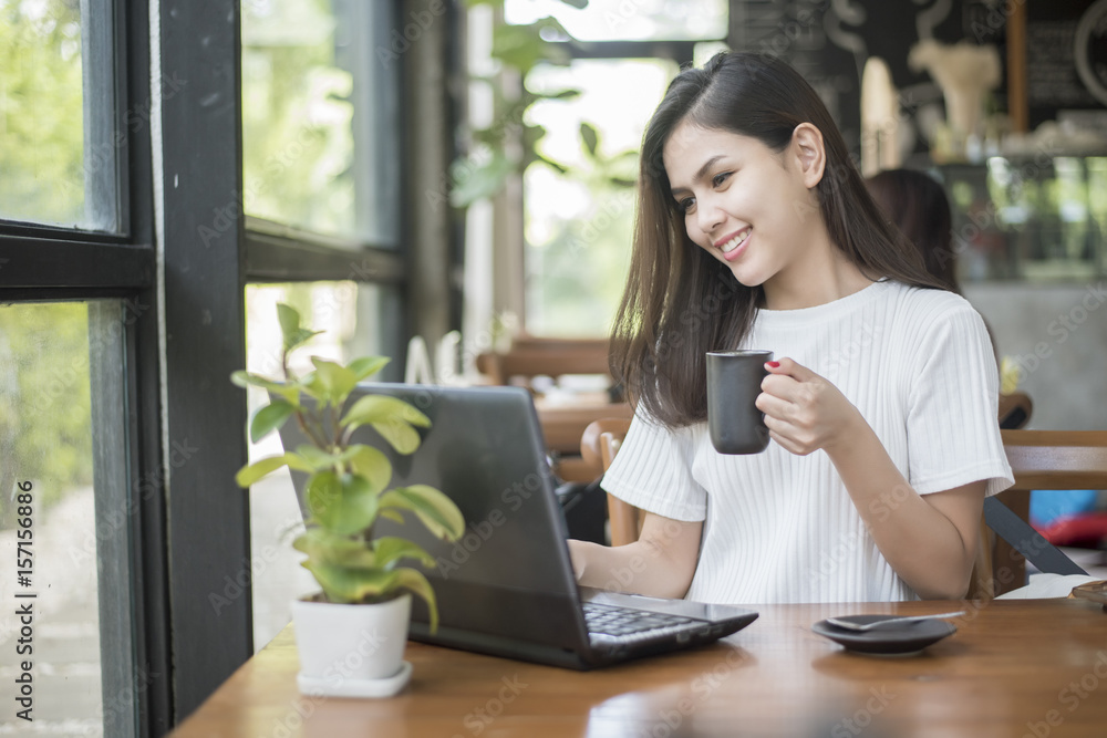 Beautiful business girl working with tablet , smartphone and drinking coffee in coffee shop Beautiful business girl working with tablet , smartphone and drinking coffee in coffee shop