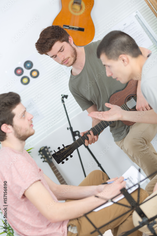 Obraz premium Young musicians composing and rehearsing