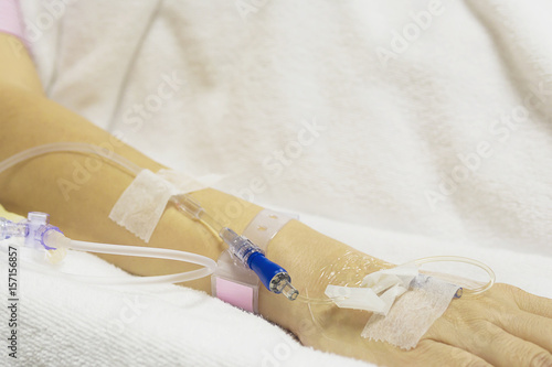 A patient is receiving medication via intravenous therapy