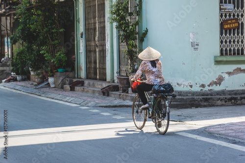 Fototapeta Naklejka Na Ścianę i Meble -  Vietnamese Woman on Bicycle