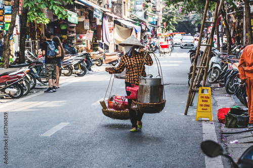 Fototapeta Naklejka Na Ścianę i Meble -  Vietnamese Street Vendor with Baskets