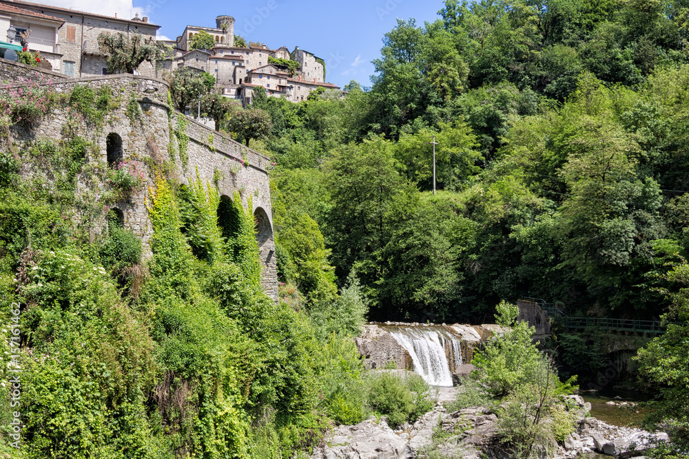 Bagnone town with river and waterfall. Scenic Italy, Lunigiana, north Tuscany