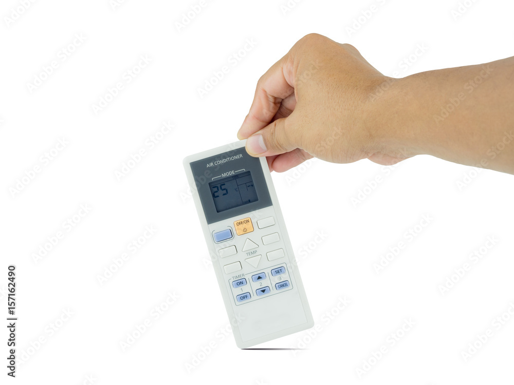 hand holding air conditioner remote control isolated on white background. clipping path. hand holding air conditioner remote control isolated on white background. clipping path.