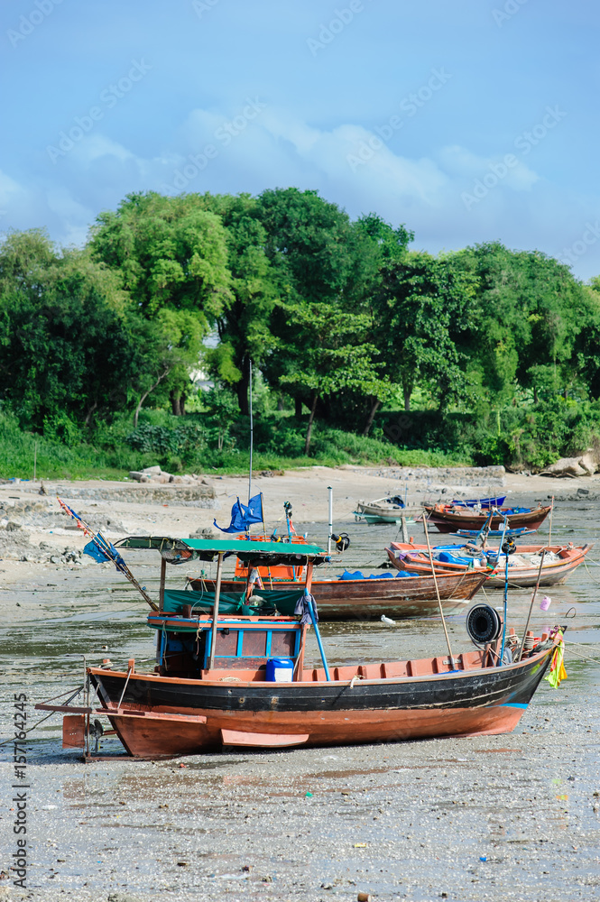 Thai's fishing boat lay on a beach