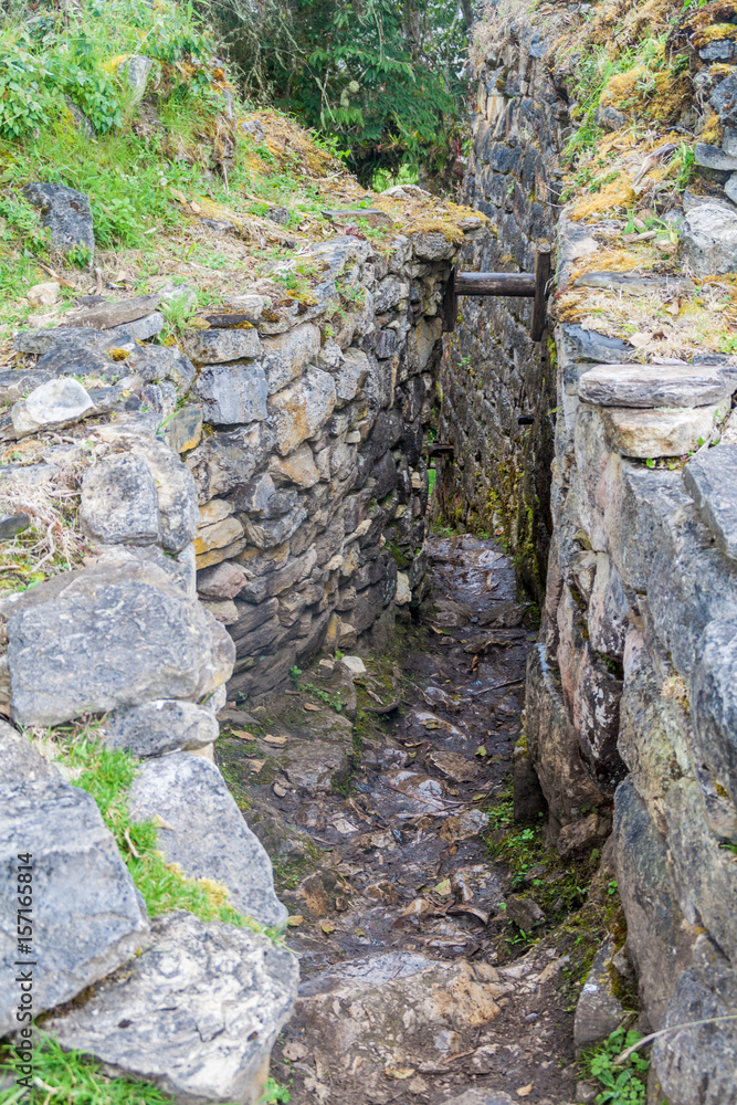 Narrow stairway at Kuelap ruins, northern Peru