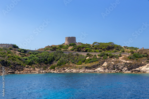 The island of Sardinia, Italy. The tower of Longosardo (16th century) on a rocky shore near the town of Santa Teresa Gallura photo