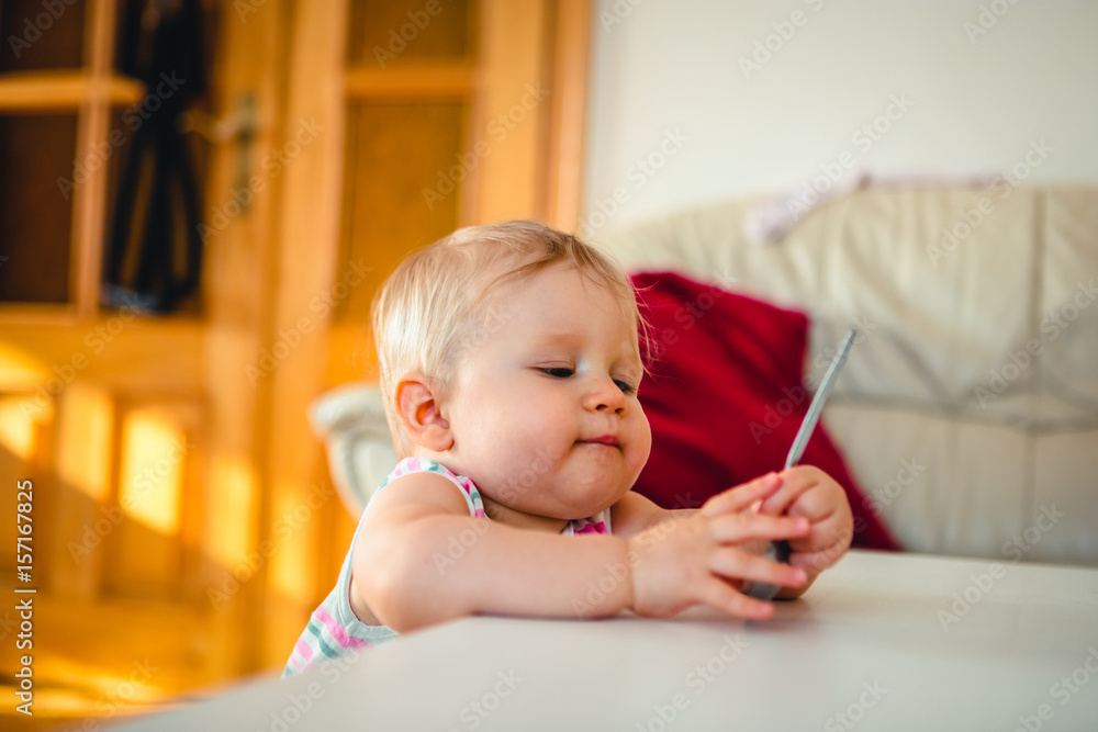 Adorable baby girl standing at home Adorable baby girl standing at home