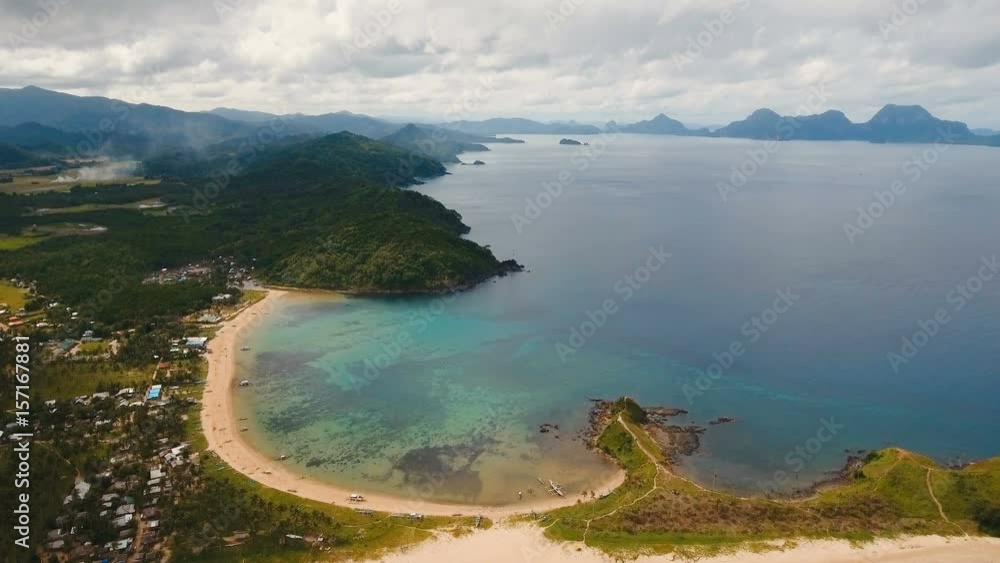 Aerial view of beautiful tropical island with sand beach. Tropical lagoon with turquoise water and yellow sand. Seascape: Ocean and a beautiful beach paradise. Beautiful view of a nice tropical beach Aerial view of beautiful tropical island with sand beach. Tropical lagoon with turquoise water and yellow sand. Seascape: Ocean and a beautiful beach paradise. Beautiful view of a nice tropical beach