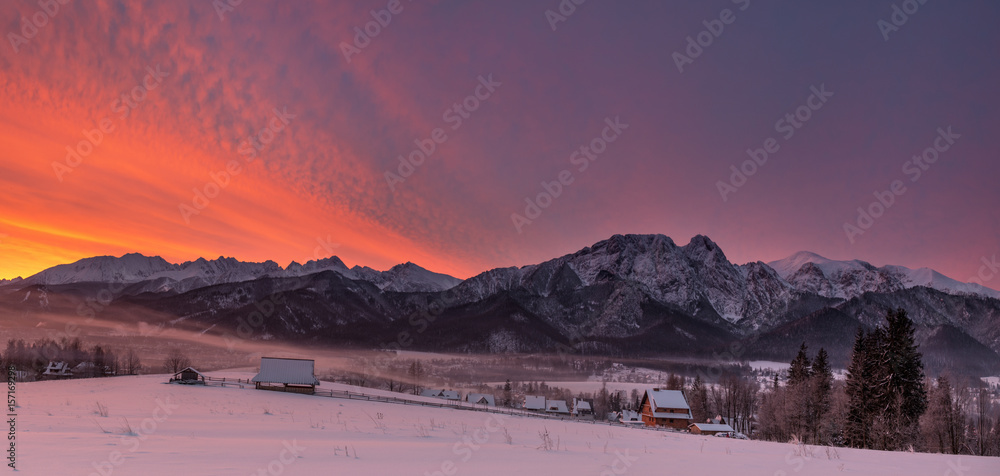 Winter Landscape Of Poland Tatra Mountains & Giewont Peak. View At Most Famous Polish Ski Resort Zakopane From The Top Of Gubalowka, Against The Background Of Snow-Capped Peaks High Tatras Mountains.