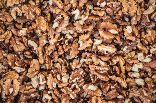 Walnuts peeled without a shell like a backdrop background or wallpaper.