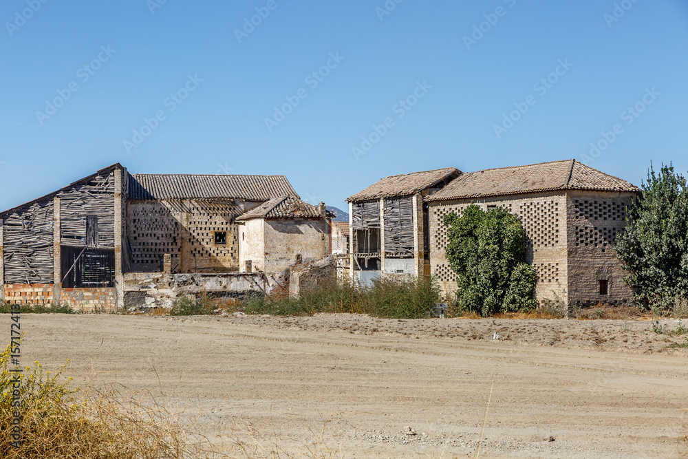 Abandoned cabins in the middle of an arid area