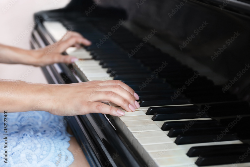 Fototapeta premium Woman playing piano