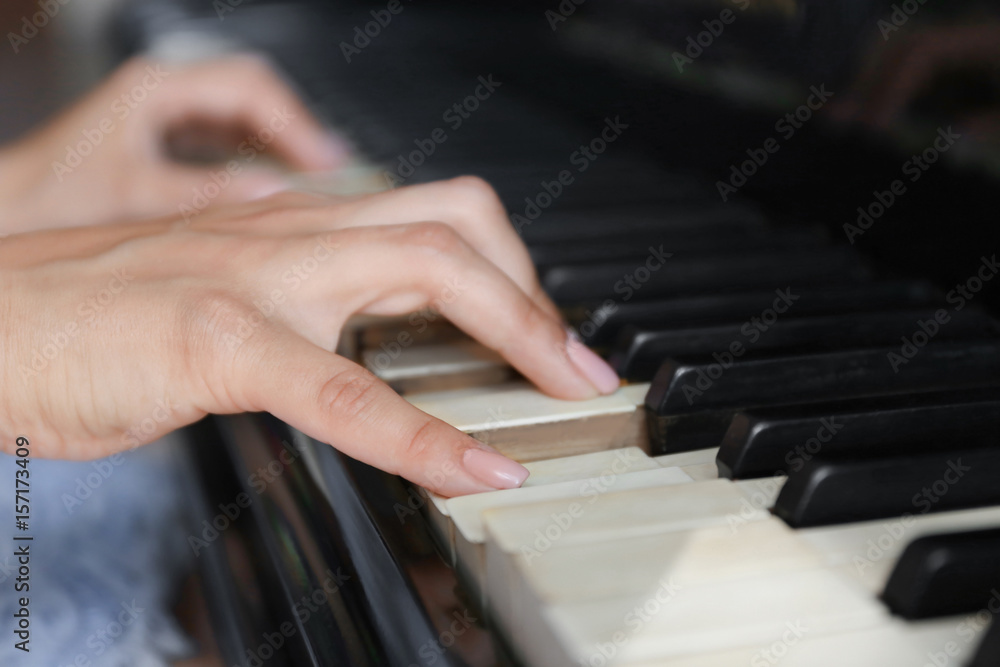 Fototapeta premium Woman playing piano