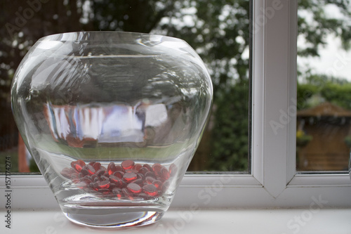 Vase filled with red glass beads