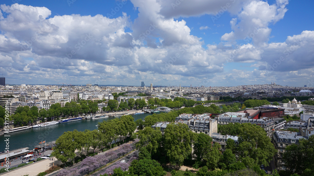 Aerial view of city of Paris from Eiffel tower with beautiful scattered clouds, Paris, France