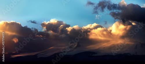Fototapeta Naklejka Na Ścianę i Meble -  Altai Ukok the sunset over the mountains in cloudy cold weather. Wild remote places, no one around. Rain clouds over the mountains