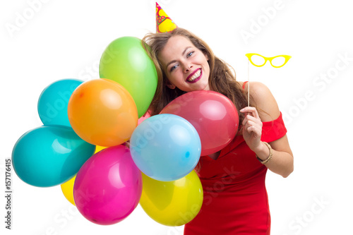 Young woman holding balloons