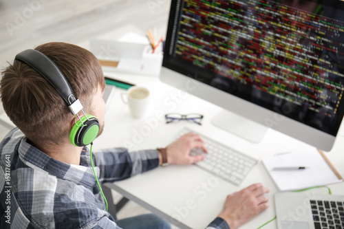 Young programmer at workplace