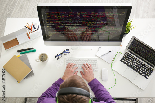 Young programmer at workplace