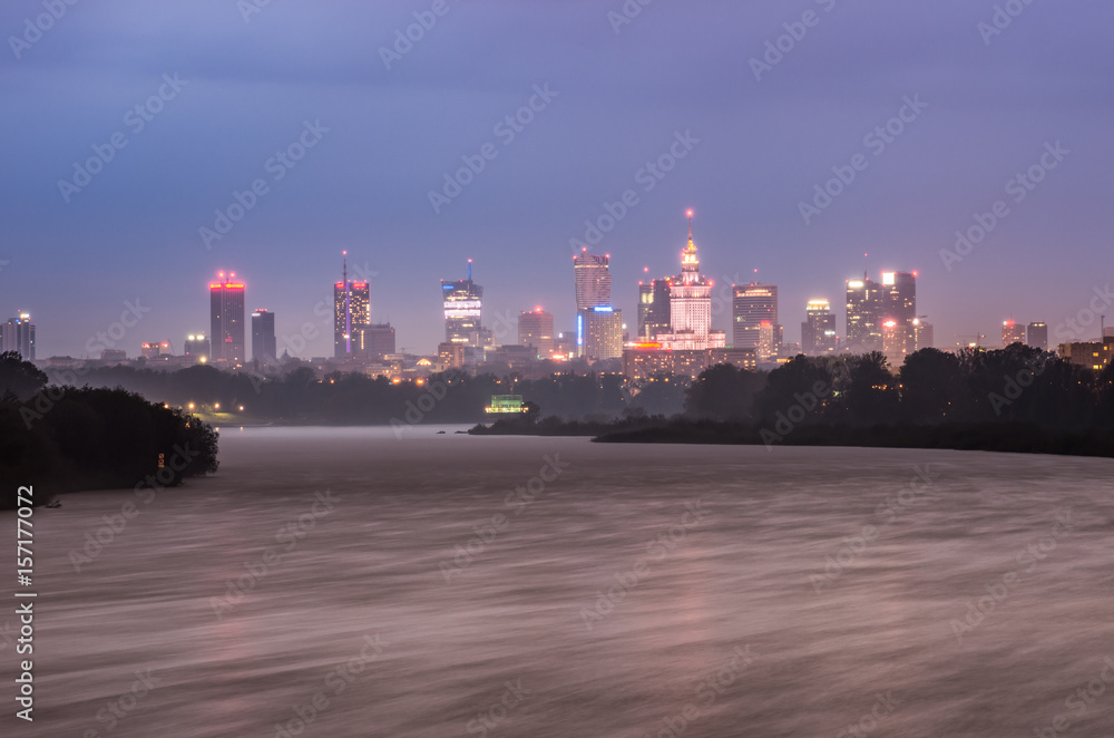 Night panorama of Warsaw skyline, Poland, over Vistula river in the night