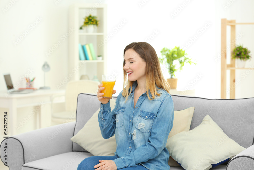Beautiful woman drinking fresh juice at home Beautiful woman drinking fresh juice at home