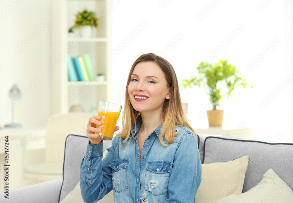 Beautiful woman drinking fresh juice at home Beautiful woman drinking fresh juice at home