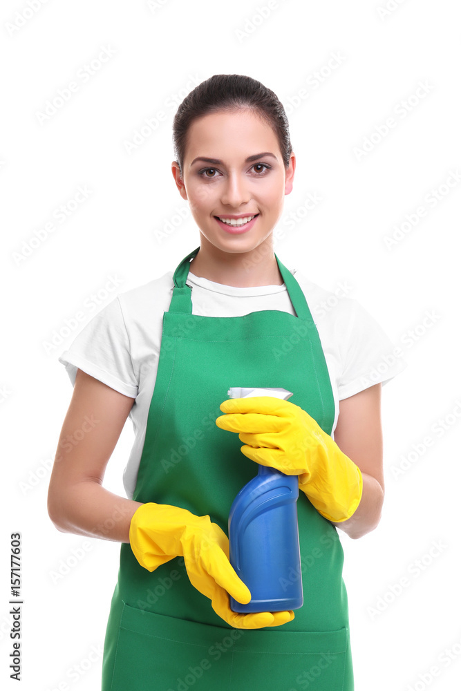 Cleaning concept. Young woman in green apron holding cleanser on white background Cleaning concept. Young woman in green apron holding cleanser on white background