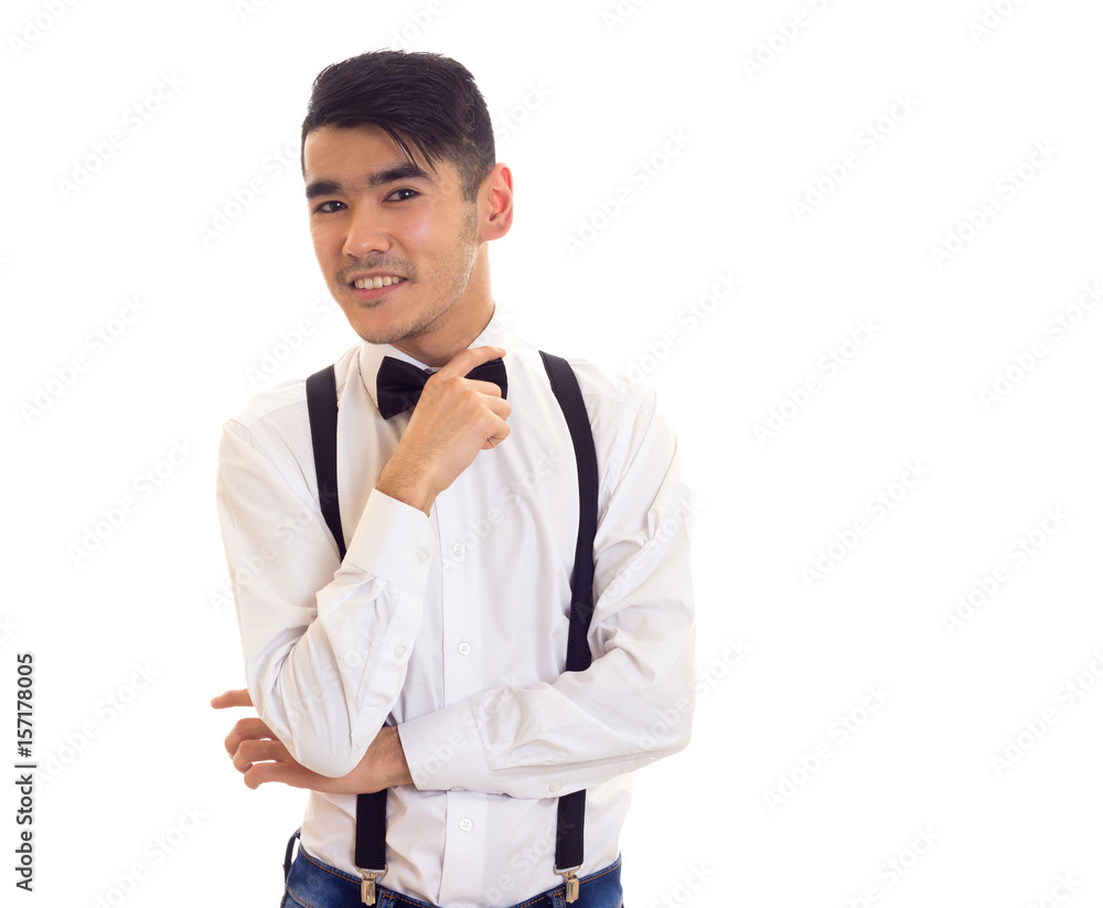 Young man with bow-tie and suspenders Young man with bow-tie and suspenders