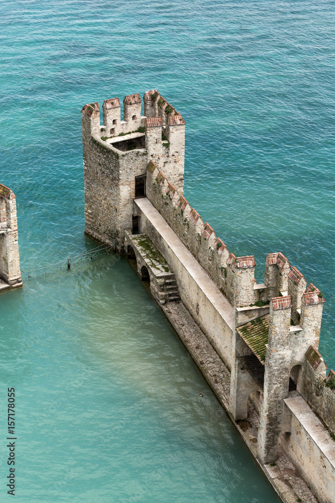  Medieval castle Scaliger in old town Sirmione on lake Lago di Garda. Italy