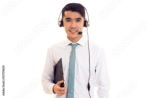 Young man in headphones holding a folder  photo