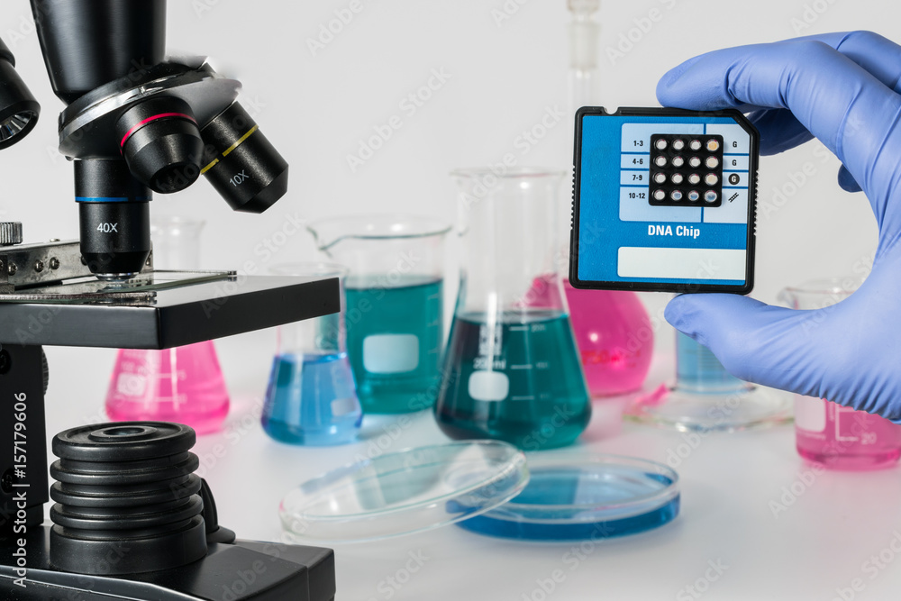 Analysis of DNA sequences in genetic laboratory Medical Research in Genetics and DNA Science. Microscope and laboratory vessels