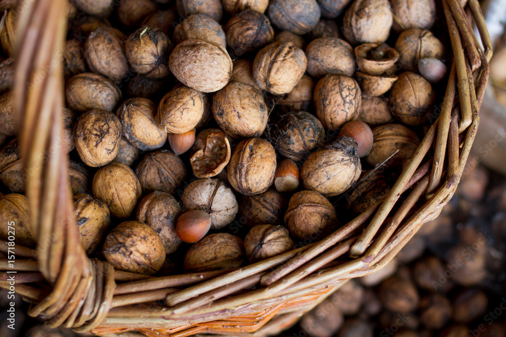 Fototapeta premium walnuts in a wicker basket