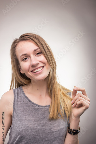 young woman, clapping fingers, happy smiling candid