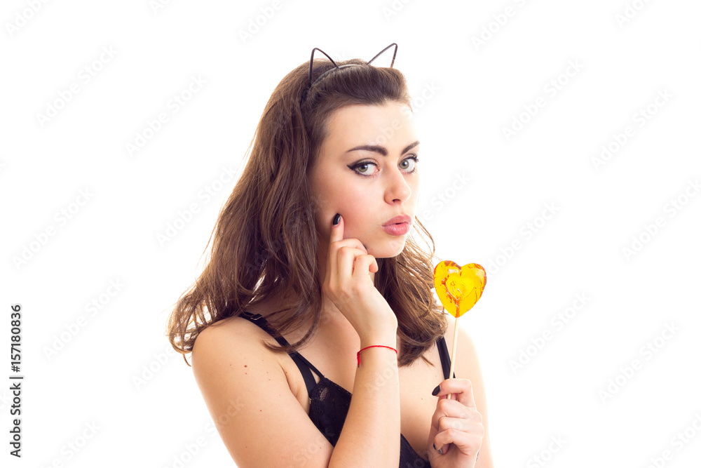 Young woman in black bra with candy Young woman in black bra with candy