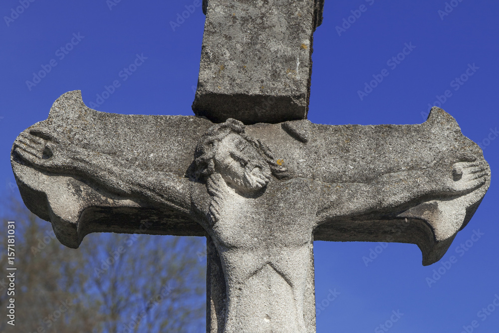 Fototapeta premium crucifixion of Jesus Christ as a symbol of resurrection and immortality of the human soul (ancient stone statue)