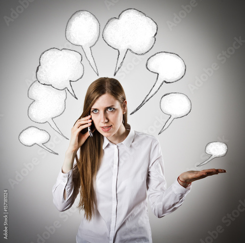 Schilderij op canvas Woman in white with telephone and blank speech bubbles over her head