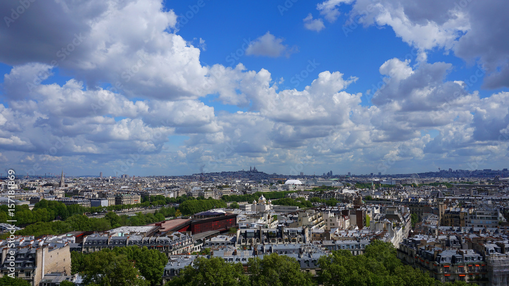 Aerial view of city of Paris from Eiffel tower with beautiful scattered clouds, Paris, France