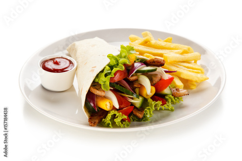 Tortilla wrap with french fries on white background 