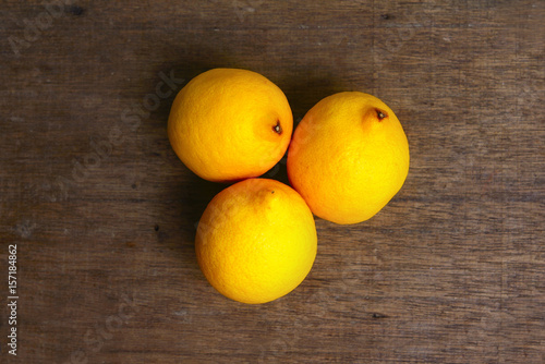 Yellow Fresh Lemon Over Wooden Background