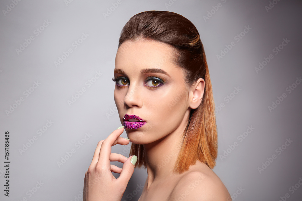 Beautiful young woman with creative makeup on color background Beautiful young woman with creative makeup on color background