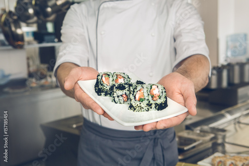  Man japanese restaurant chef cooking in the kitchen