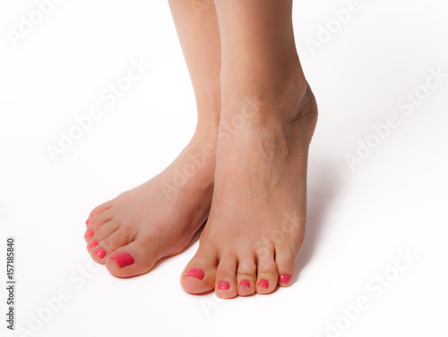 Beautiful feet with perfect spa nail pedicure on white background © Maxim