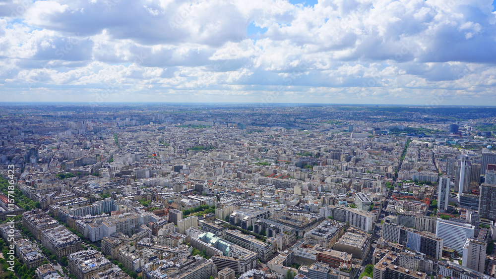 Aerial view of city of Paris from Eiffel tower with beautiful scattered clouds, Paris, France