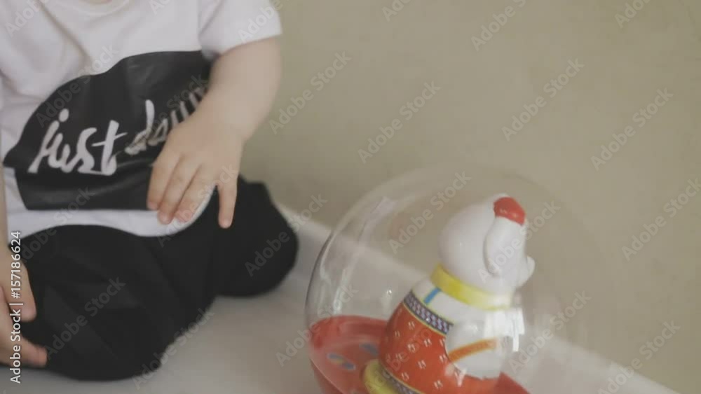 A small child walks around the apartment while parents do not see. Family at home A small child walks around the apartment while parents do not see. Family at home