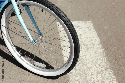 Bicycle wheel on zebra crossing, outdoor