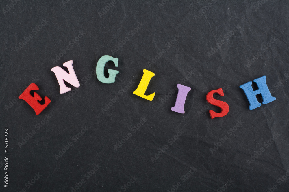 English word on black board background composed from colorful abc alphabet block wooden letters, copy space for ad text. Learning english concept. English word on black board background composed from colorful abc alphabet block wooden letters, copy space for ad text. Learning english concept.