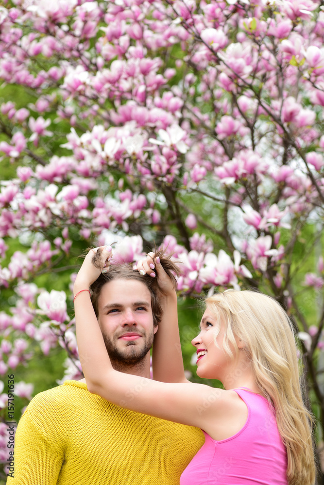 friends or lovers near magnolia flower, couple in love friends or lovers near magnolia flower, couple in love